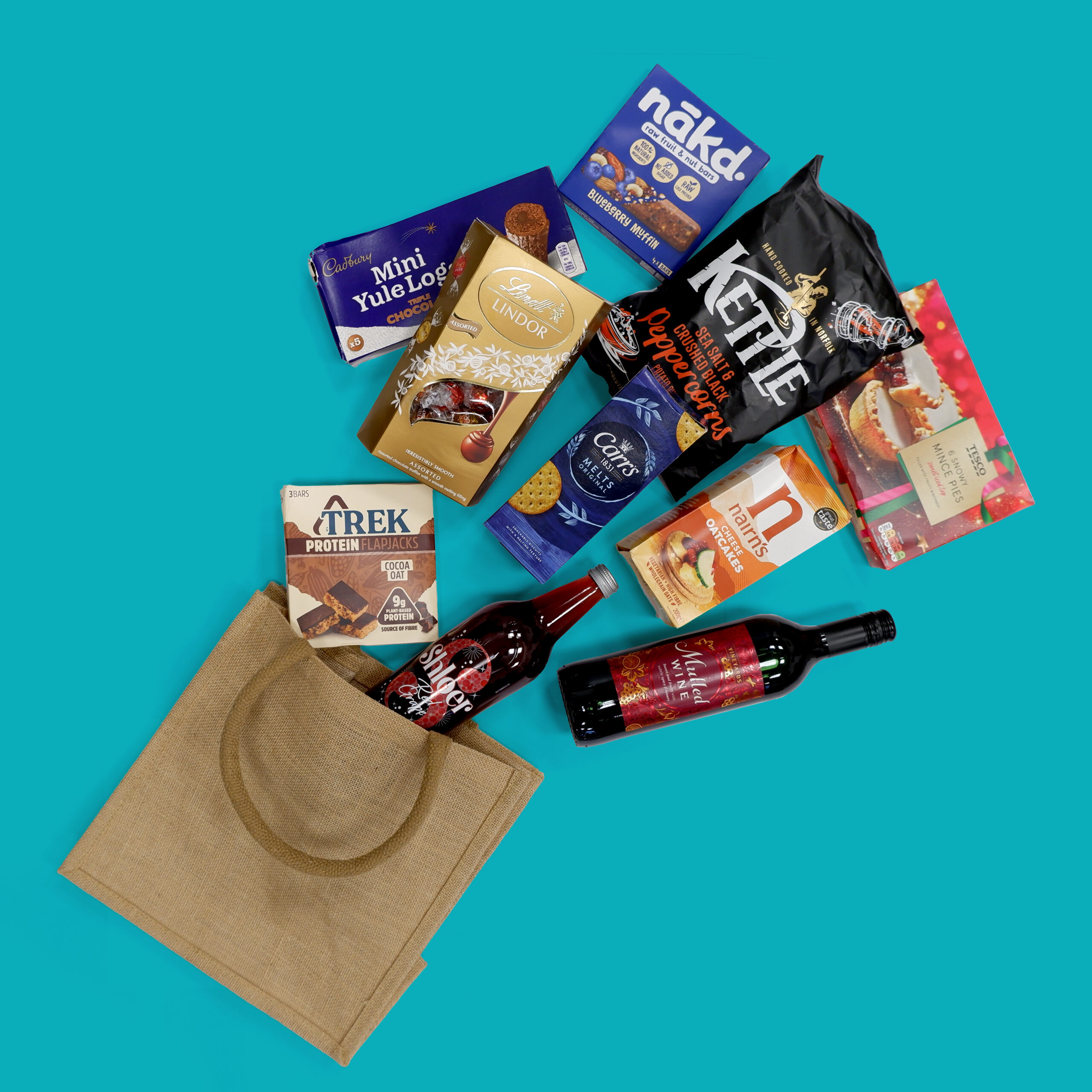 Person holding a branded jute shopping bag