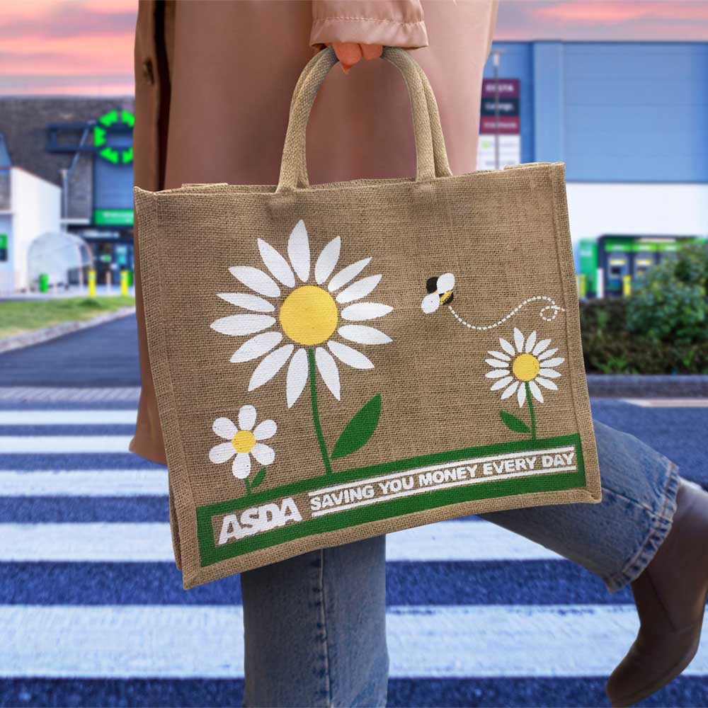 A person carrying an ASDA sustainable natural jute bag by GoJute