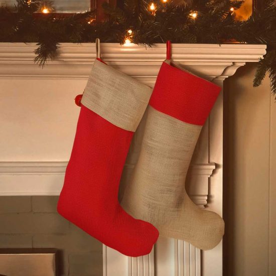 Jute stockings hung over a fireplace